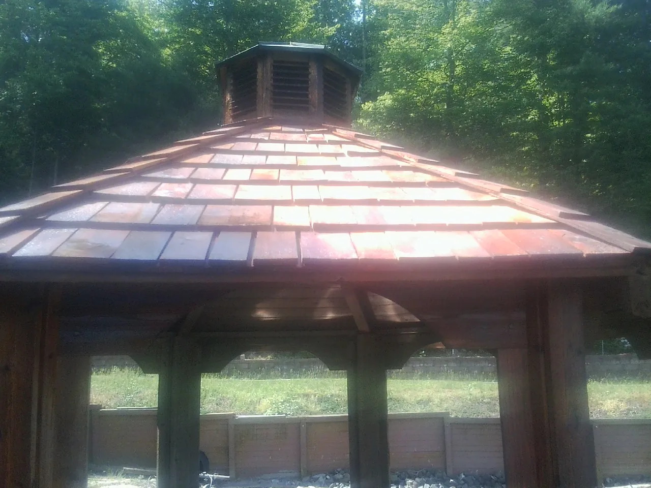 New cedar shake roof and cupola on a lakeside gazebo in Fort Lupton
